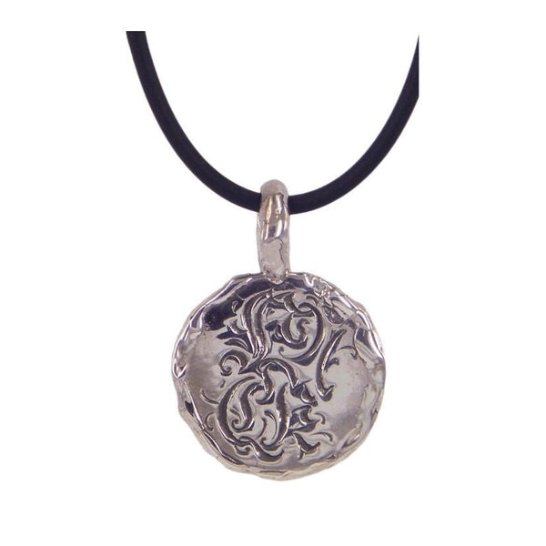 Fuck (wonky disc) pendant by Ali Alexander. A striking pendant with exceptional craftsmanship, highlighting Australian handmade jewellery.