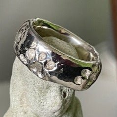 Paws men's ring by Ali Alexander. Handcrafted in sterling silver, featuring etched paw prints, perfect for animal lovers seeking unique style. 