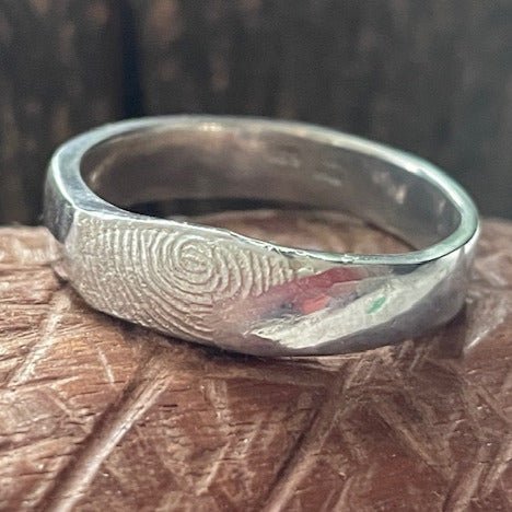 Fingerprint ring (4mm) handcrafted in sterling silver, featuring a personalised fingerprint design, making each ring unique and one-of-a-kind.