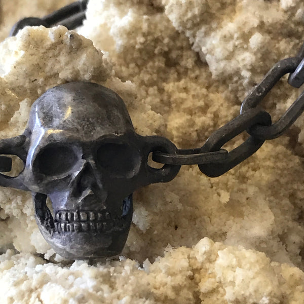 Skull bracelet by Aimee Sutanto. Handcrafted in oxidised sterling silver, featuring sculpted skulls linked in a bold, edgy Australian design.