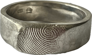 7mm fingerprint ring, handcrafted in sterling silver, featuring a personalised fingerprint engraving, offering a distinctive and custom-made design.