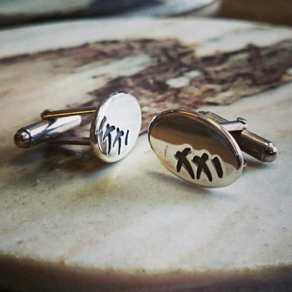 XXI cufflinks by Ali Alexander. Handcrafted in sterling silver, featuring Roman numerals for 21—a bold gift for a 21st birthday celebration.