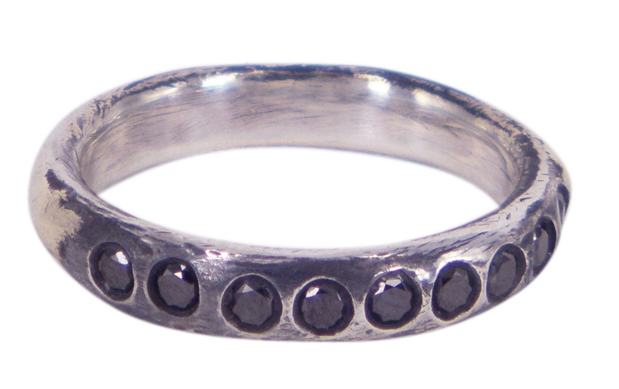 Brush Stroke men's wedding ring in sterling silver with 9 black diamonds, crafted by Unnon. A Melbourne-made design with artistic flair.

