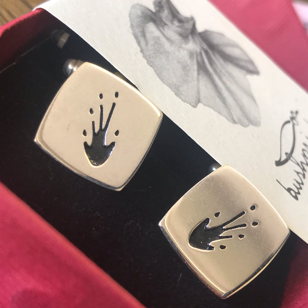 Frill-neck lizard cufflinks by Bushprints Jewellery. Handcrafted in sterling silver with real lizard tracks—a tribute to Aussie reptilian life.