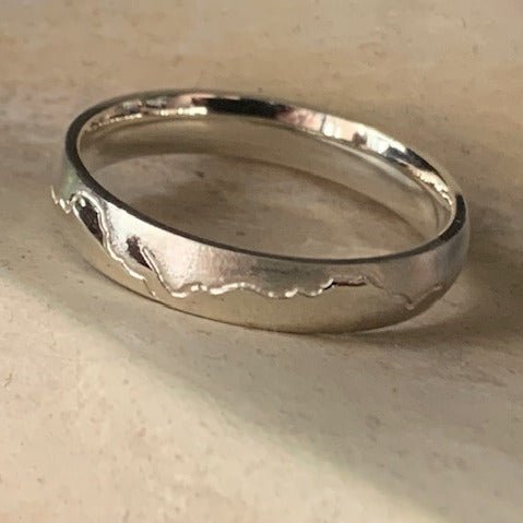 Coast wedding ring by Danielle Sweeney. Handcrafted in 9ct white gold, with smooth curves inspired by the ebb and flow of the Australian coastline.