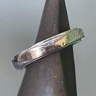 Rough & Raw narrow ring by Gavin Macsporran. Handcrafted in sterling silver with 18ct gold, featuring a raw, textured design for an organic, bold look.