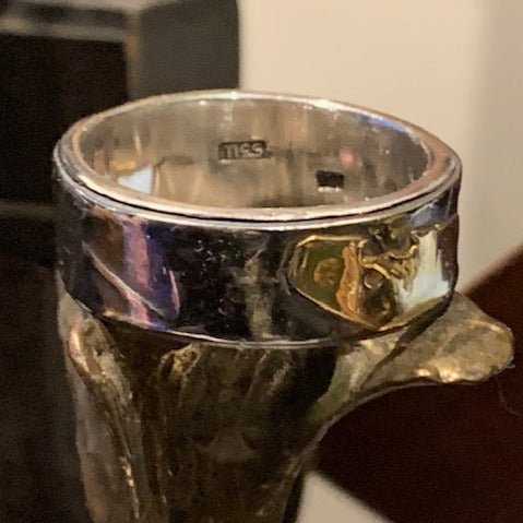 Rough & Raw rolled inner ring by Gavin Macsporran. Handcrafted in sterling silver with a textured exterior and smooth, polished inner band, featuring modern contrast.