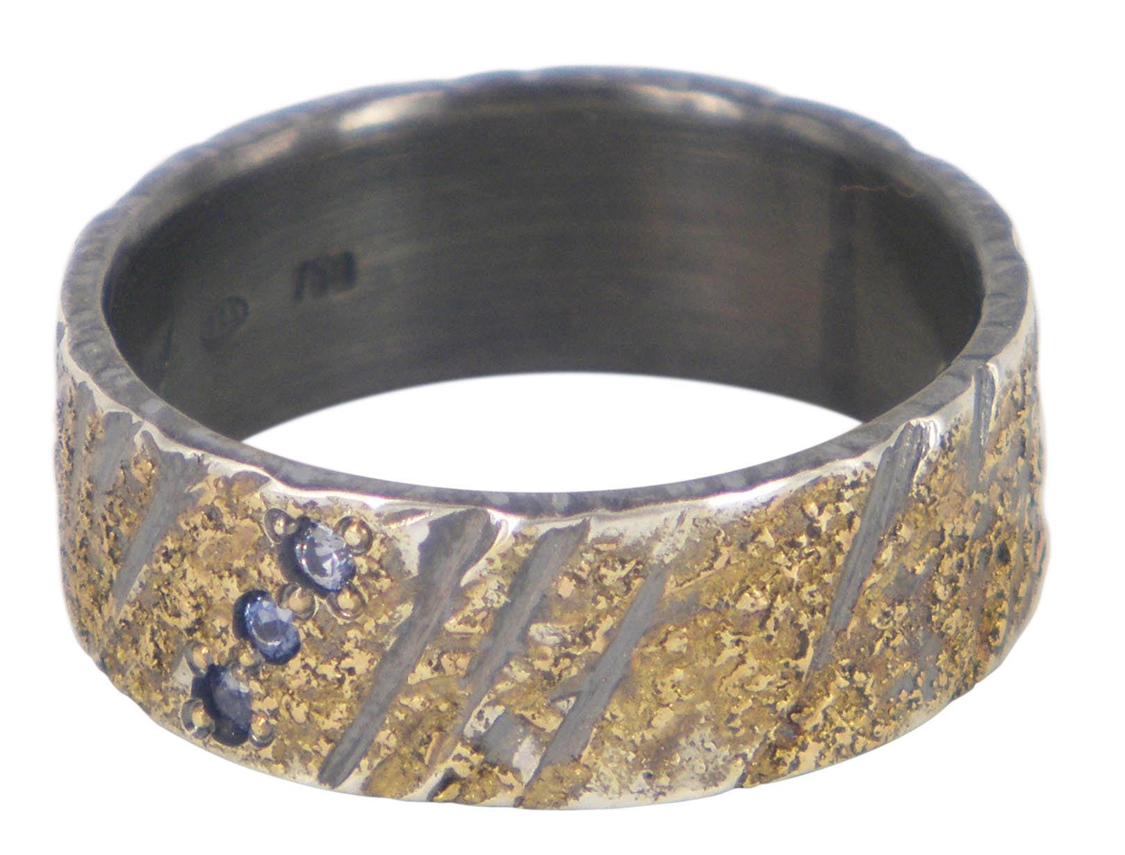 Handmade men's wedding ring by Jeanette Dyke in oxidised silver and gold, featuring 3 blue sapphires. Unique Melbourne-made Australian craftsmanship.