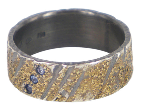 Handmade men's wedding ring by Jeanette Dyke in oxidised silver and gold, featuring 3 blue sapphires. Unique Melbourne-made Australian craftsmanship.