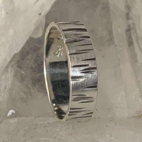 Narrow Bark men's ring by Melissa Baldock. Handcrafted in sterling silver, featuring a sleek bark-inspired texture for a modern, nature-infused design.