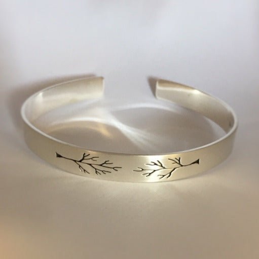 Pierced Tree cuff by Melissa Baldock. Handcrafted in sterling silver, featuring an intricate tree design with delicate cut-out details for a nature-inspired look.