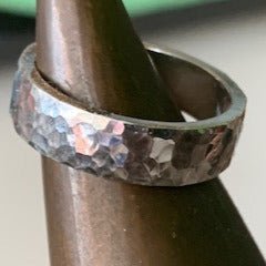 Hammered ring by Melissa Baldock. Handcrafted in sterling silver, featuring a textured hammered finish that adds depth and character to its modern design.
