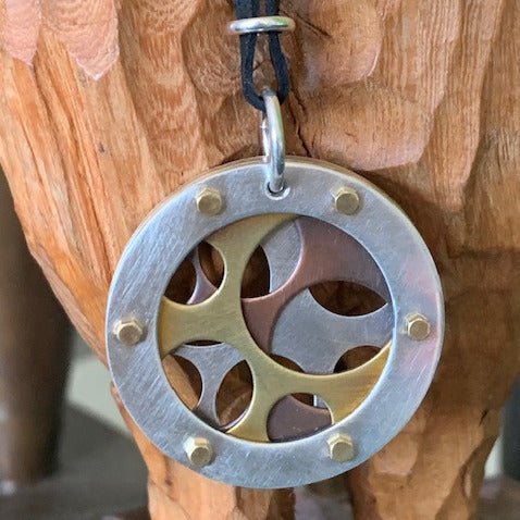 Industry pendant by Melissa Baldock. Handcrafted in sterling silver, featuring a geometric design inspired by industrial forms for a bold, modern look.