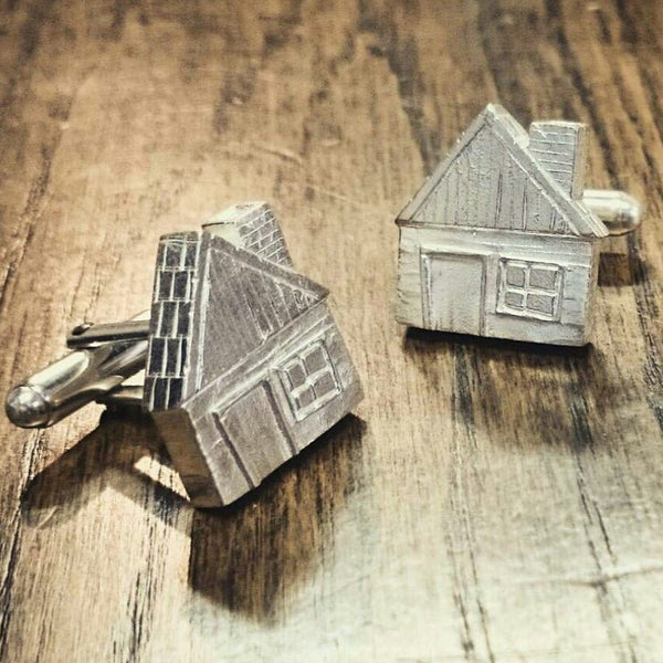 Houses cufflinks by Philip Monk. Handcrafted in sterling silver, featuring detailed house designs for a unique, architectural-inspired accessory.