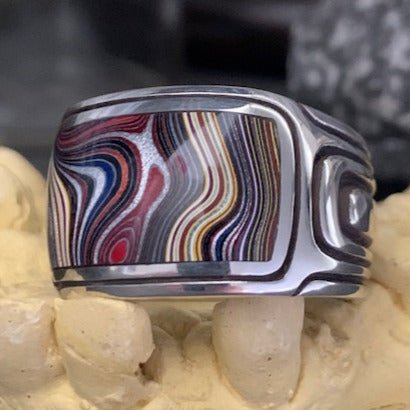 Swell ring with Fordite by Sebastian Cilento. Handcrafted in sterling silver, featuring layered Fordite for bold colour and Australian character.