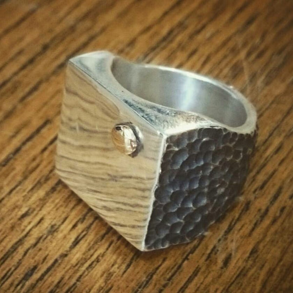 Cube signet ring by Unnon. Handcrafted in sterling silver, featuring a unique gold blob design on the face of the ring for a modern, bold statement.