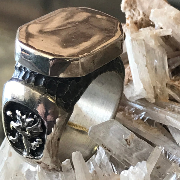 Dragon octagonal signet ring by Unnon. Handcrafted in sterling silver, featuring a detailed dragon design on the side of the ring for a bold, mythical touch.