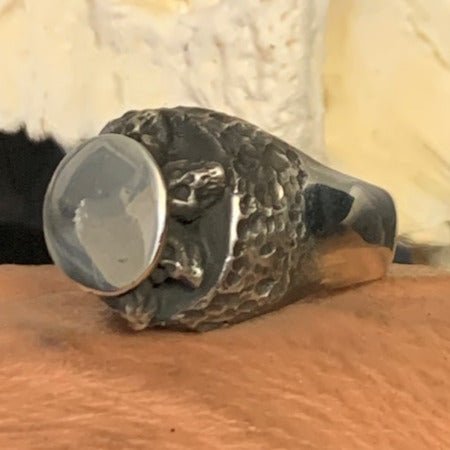 Rotunda skull signet ring by Unnon. Handcrafted in sterling silver, featuring a detailed skull design set within a bold, rounded signet shape for a striking look.